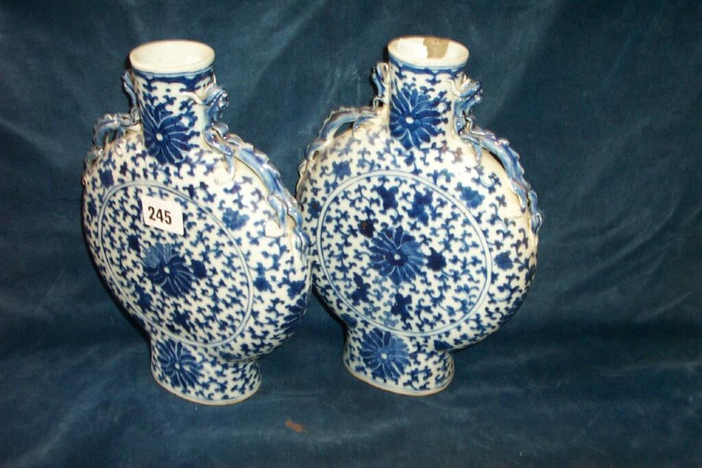 A pair of 19th century oriental moon flask style vases