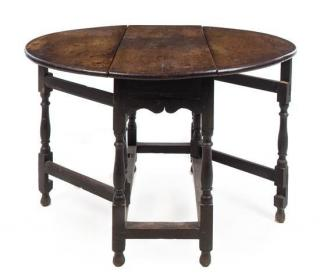 An English Oak Drop Leaf Table 18th century having a