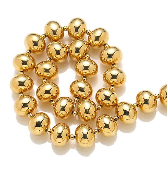 An eighteen karat gold bead necklace weighing approximately 57 5