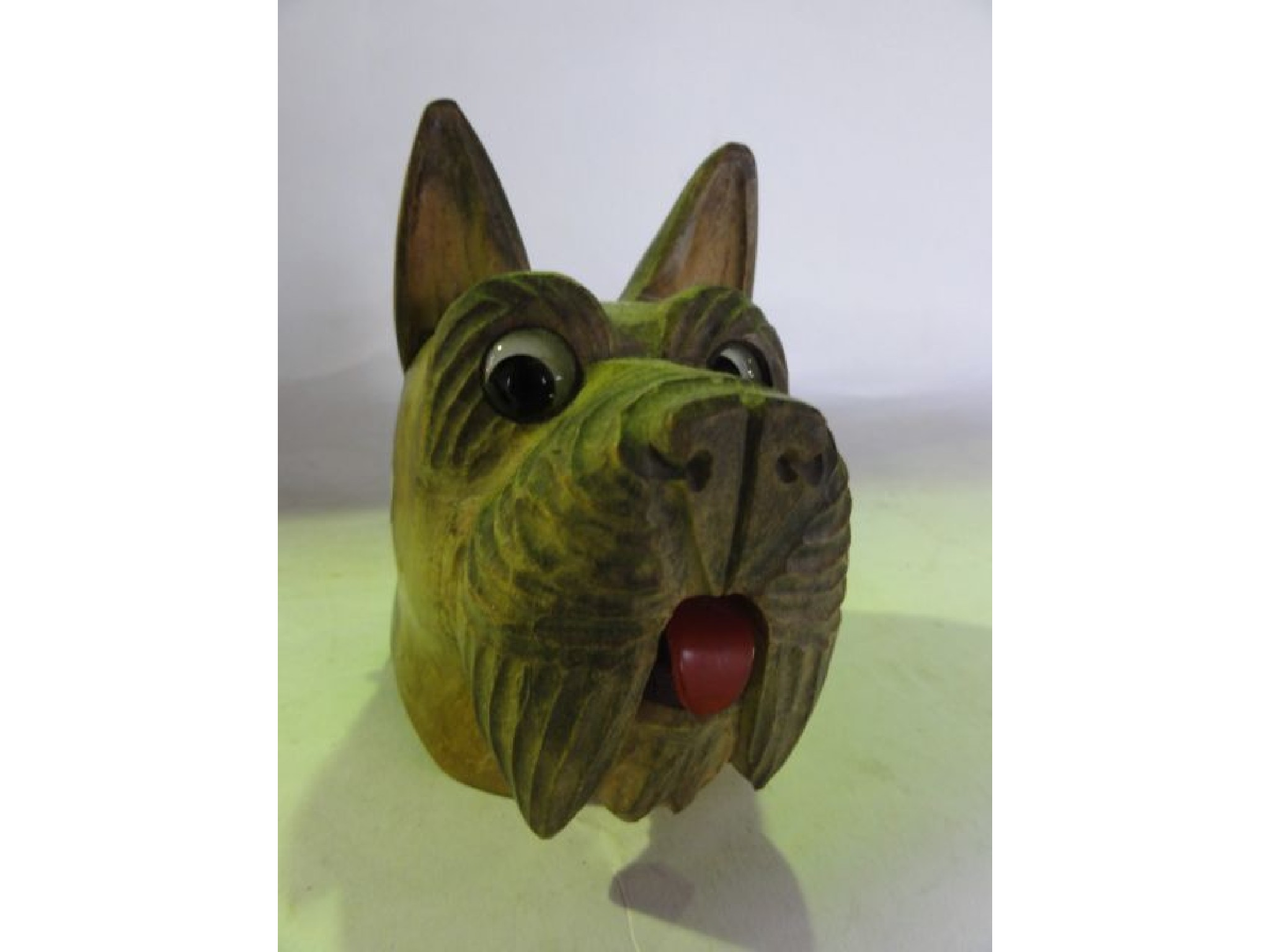 An unusual wind up desk top bell the carved timber