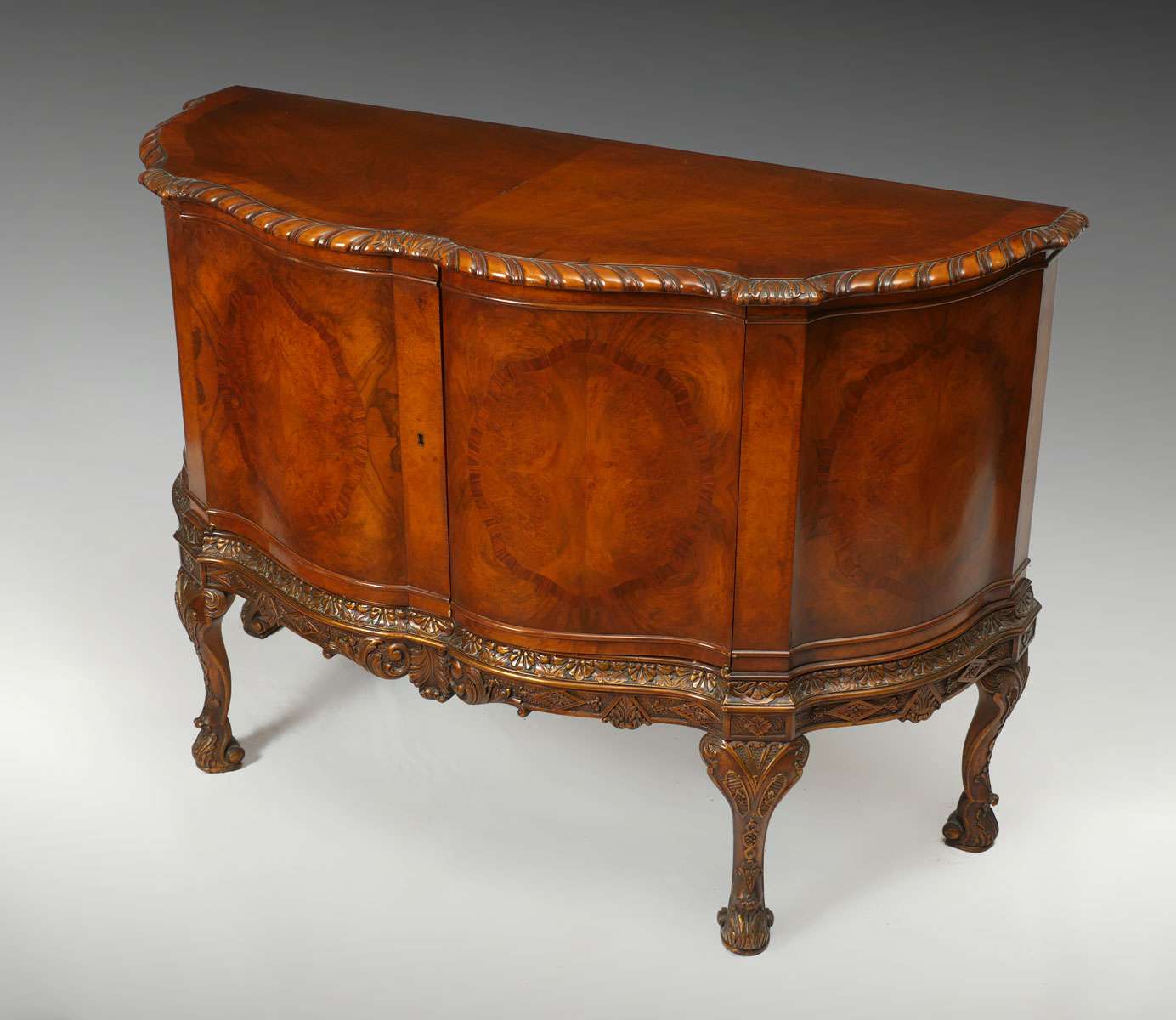 20TH CENTURY CONTINENTAL BOW FRONT SIDEBOARD A Continental Bowfront Sideboard
