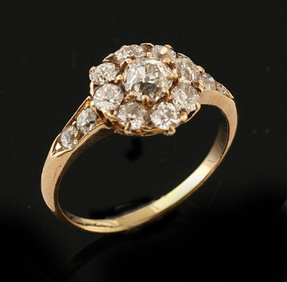 An Edwardian diamond flower cluster ring Circa 1910 The central
