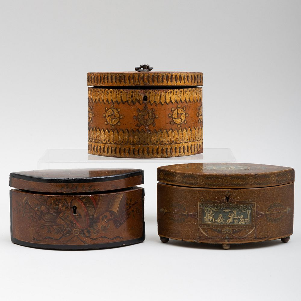 Three English Polychrome Painted Navette Form Tea Caddies The first