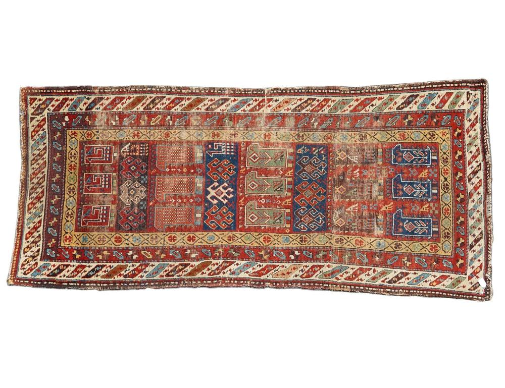 CAUCASIAN ANTIQUE RUNNER RUGAntique Caucasian runner carpet made from materials