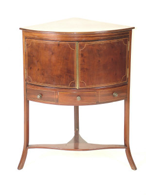 A mahogany and line inlaid corner cupboard late 19th century