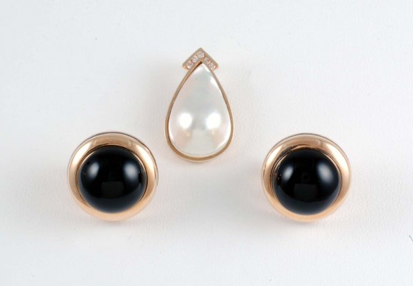 A pair of pierced earrings in marked 14K yellow gold