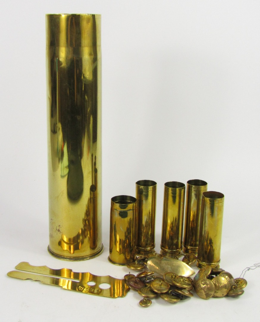 Brass shell cases military buttons livery buttons and a button