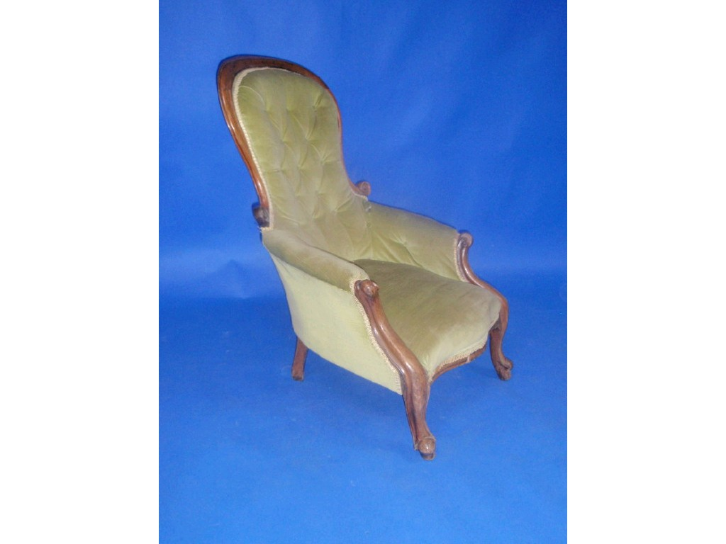 A Victorian mahogany spoon back armchair