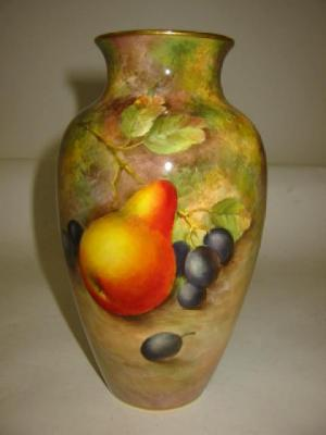 A ROYAL WORCESTER PORCELAIN VASE dated 1955 of baluster form