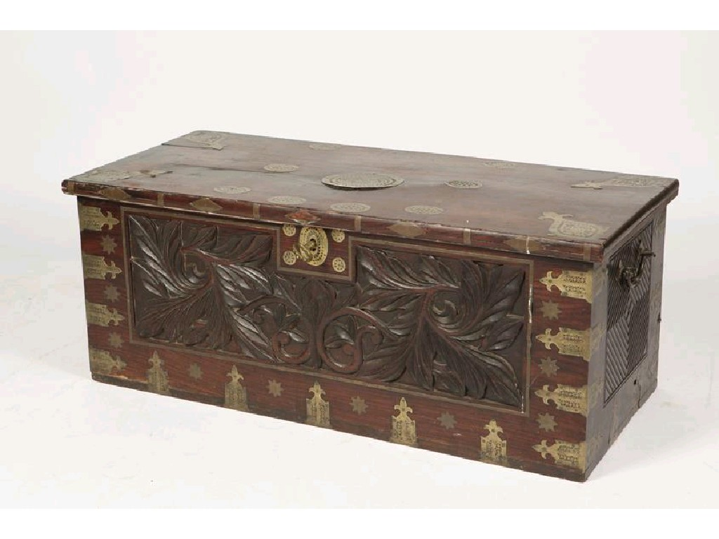 A TEAK AND BRASS BOUND TRAVELLING CHEST the rectangular top