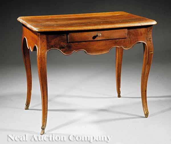 A Louis XV Walnut Table c 1760 molded top scalloped