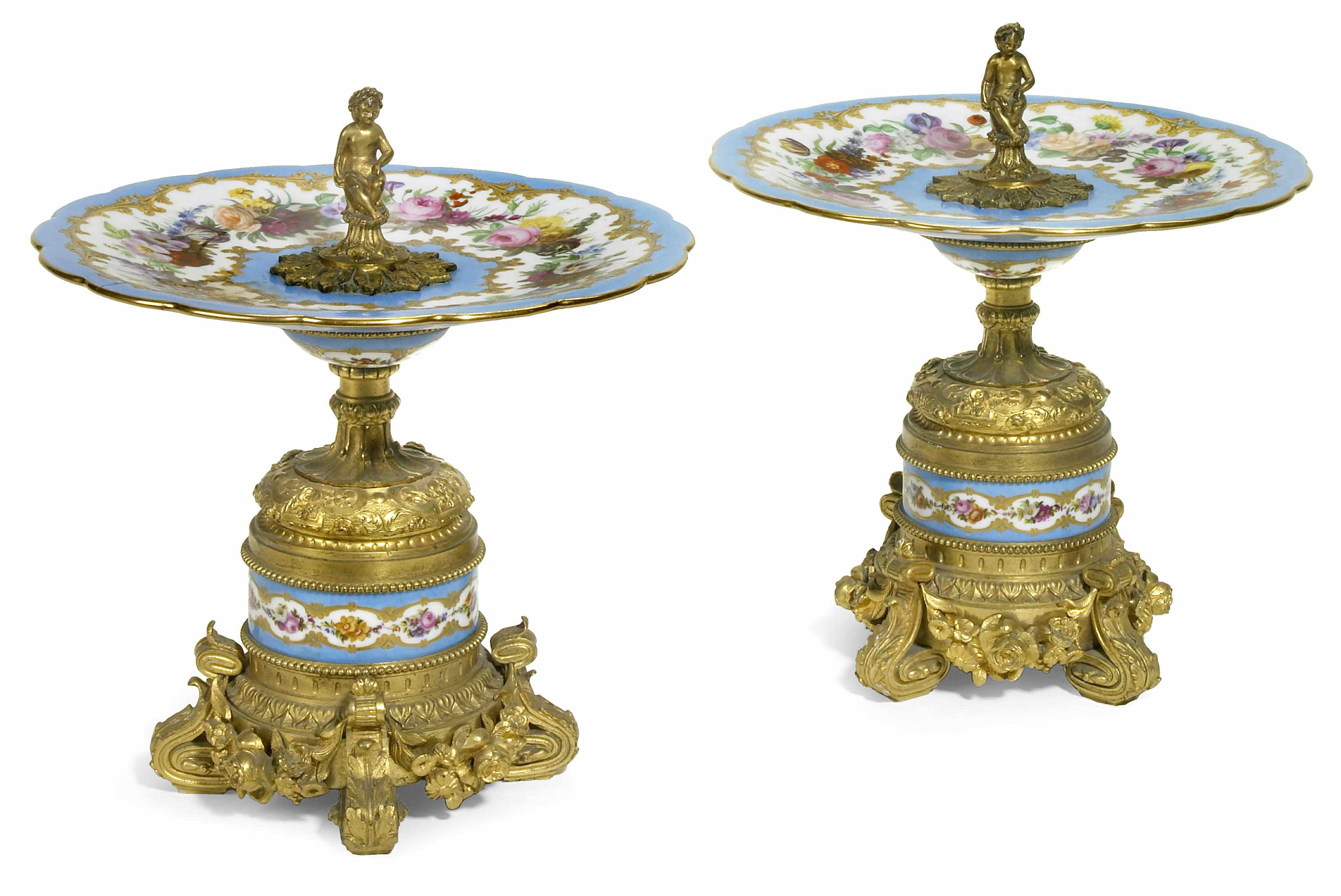A pair of Svres style porcelain and gilt bronze compotes
