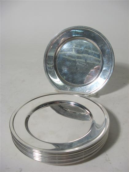 Eleven sterling silver bread plates 20th century Plain with circular