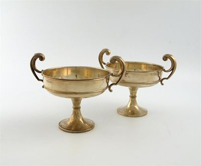 A pair of Edwardian silver two handled tazzae by A