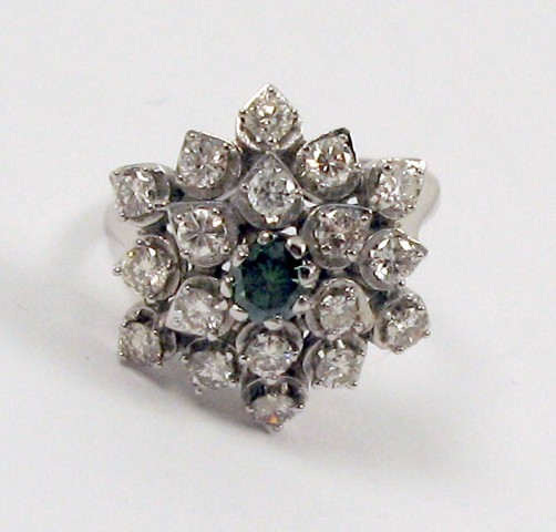 GREEN DIAMOND AND FOURTEEN KARAT GOLD RING centering a round