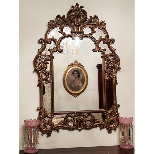 Antique style gilt Rococo revival mirror with pierced scrolling crest