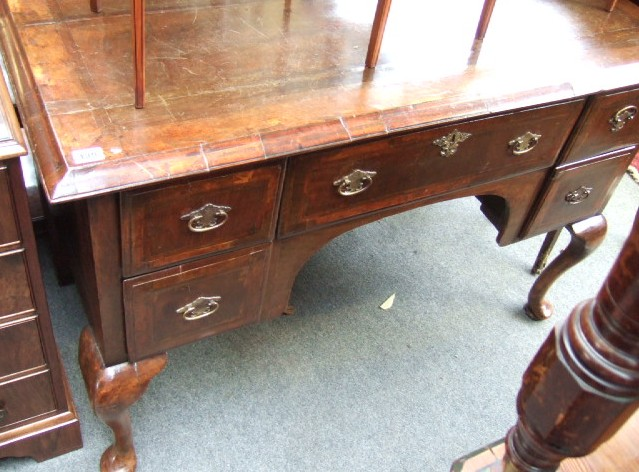 An 18th century and later mahogany and walnut kneehole dressing