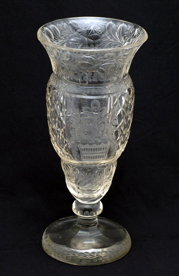 Clear glass pedestal vase intaglio cut with baskets of flowers