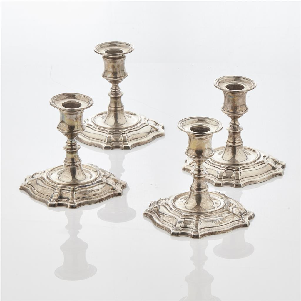 A set of four modern dwarf candlesticks W Hutton Sons