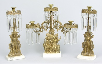 Three Piece Bronze Garniture Consisting of a center three light