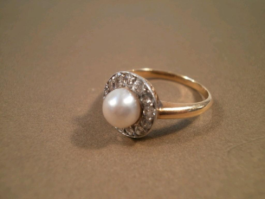 A pearl and diamond cluster dress ring yellow metal unmarked
