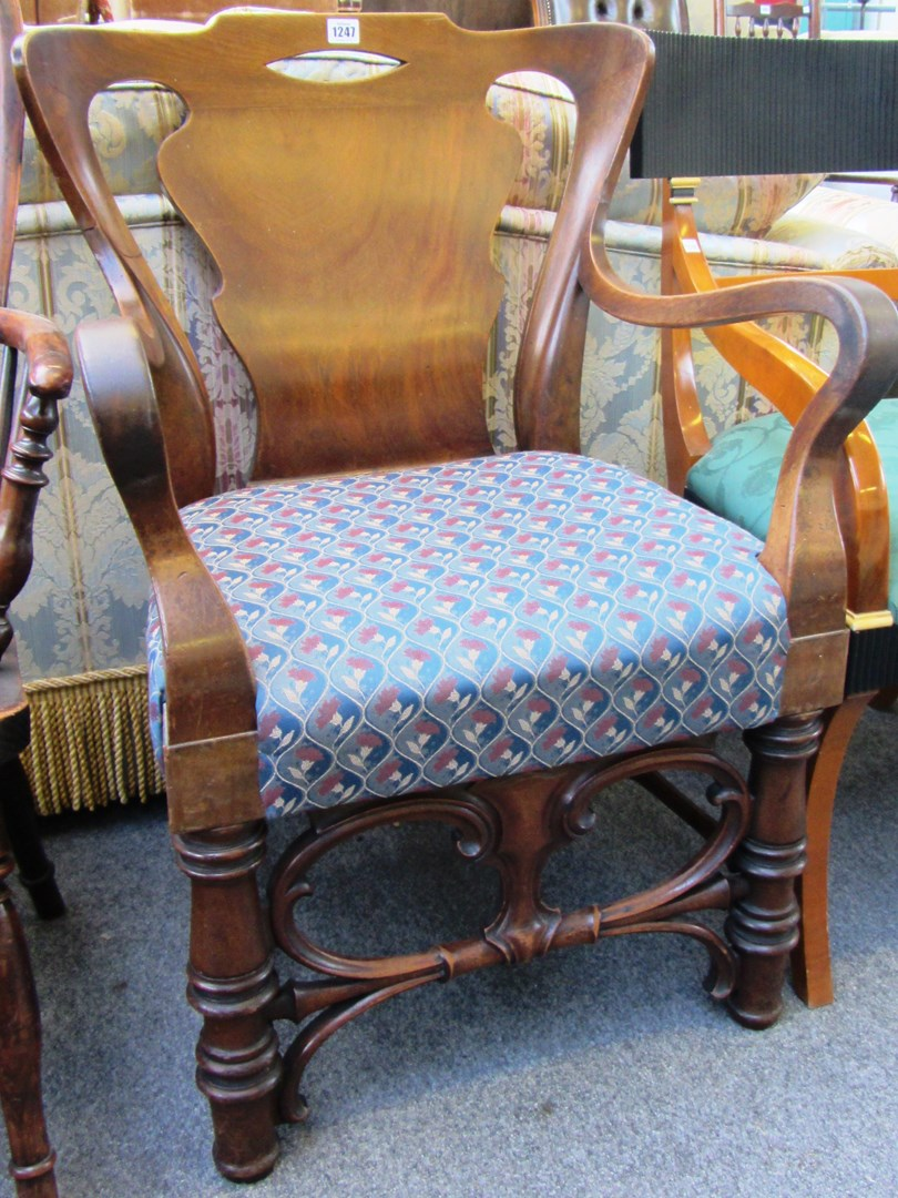A 19th century walnut framed open armchair with wide vase