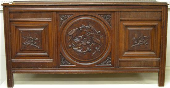 Lift top chest constructed of early panels three carved panels