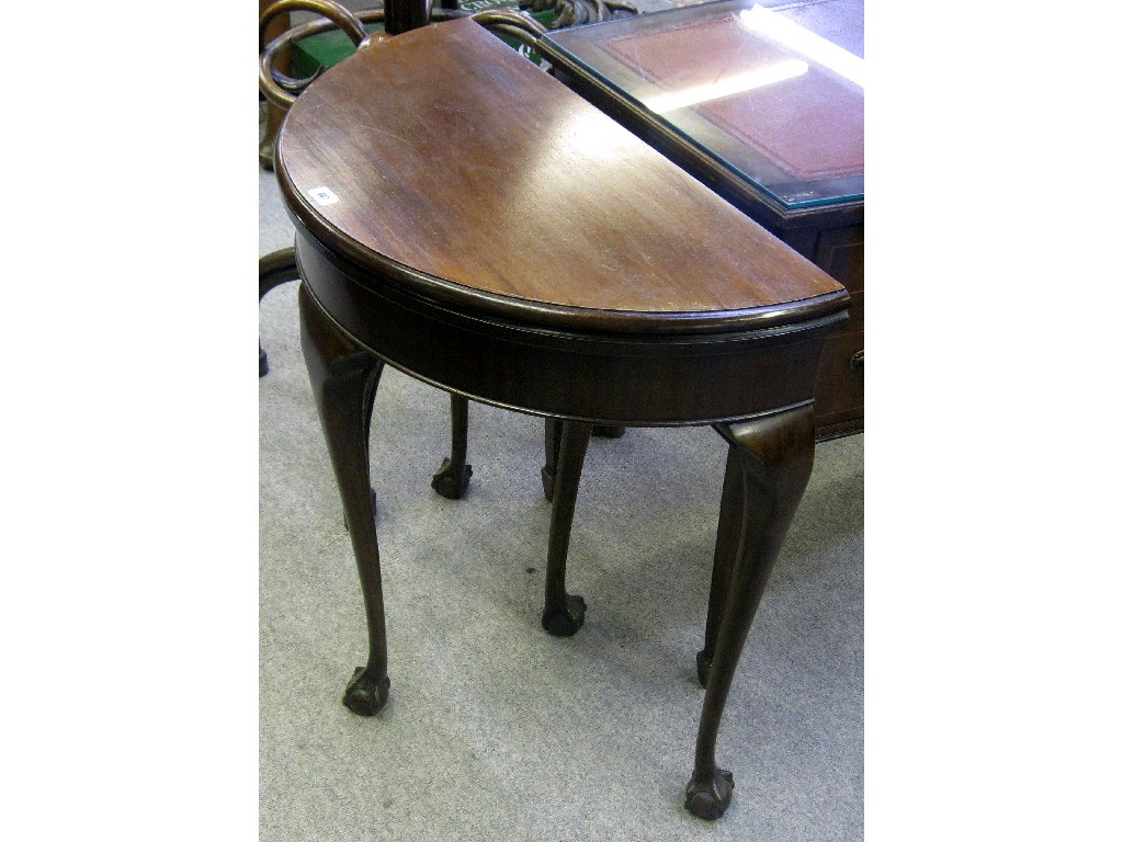 Mahogany demi lune fold over card table on ball and