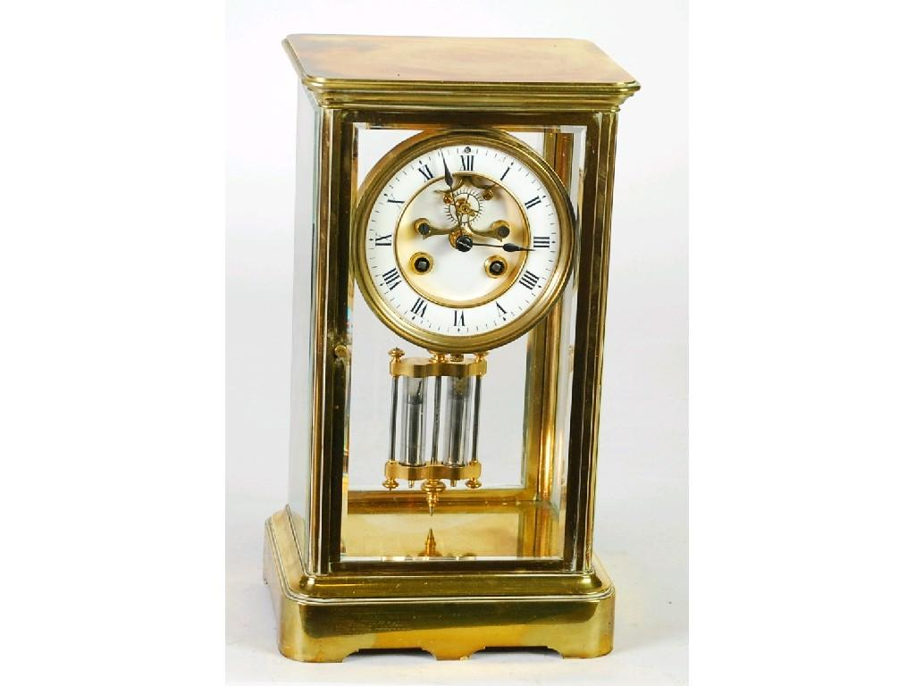 LATE NINETEENTH CENTURY FRENCH BRASS FOUR GLASS MANTEL CLOCK the