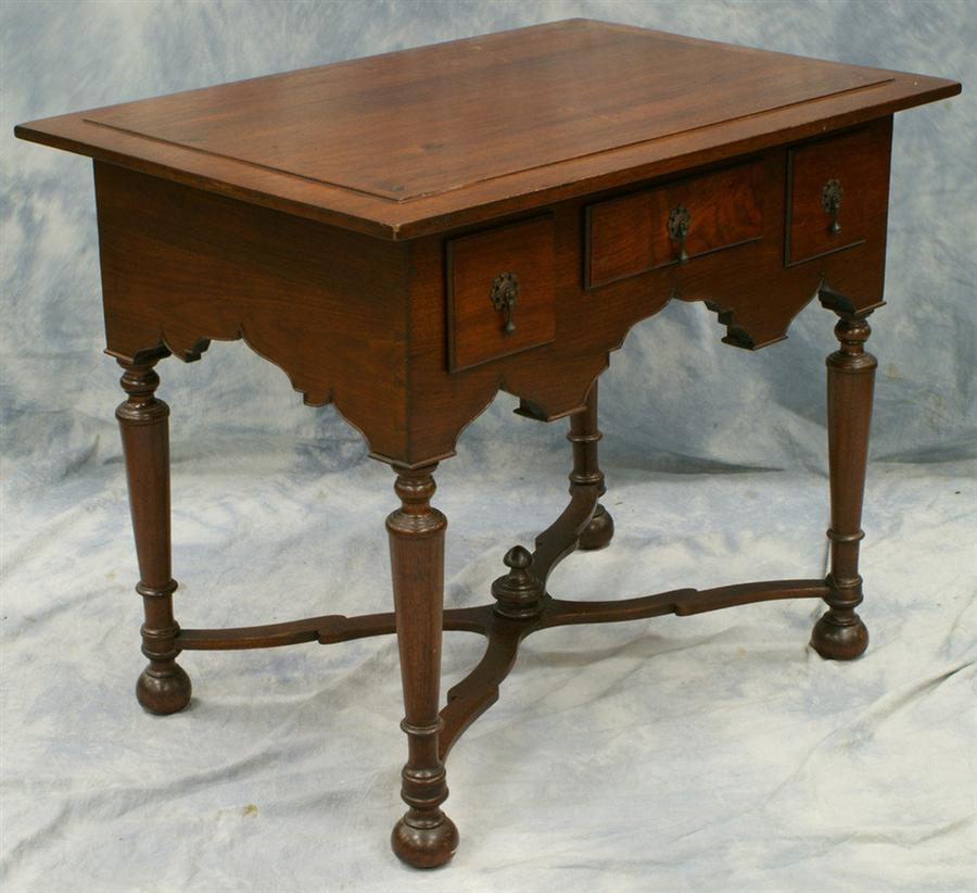 Bench made walnut William and Mary style lowboy with flat