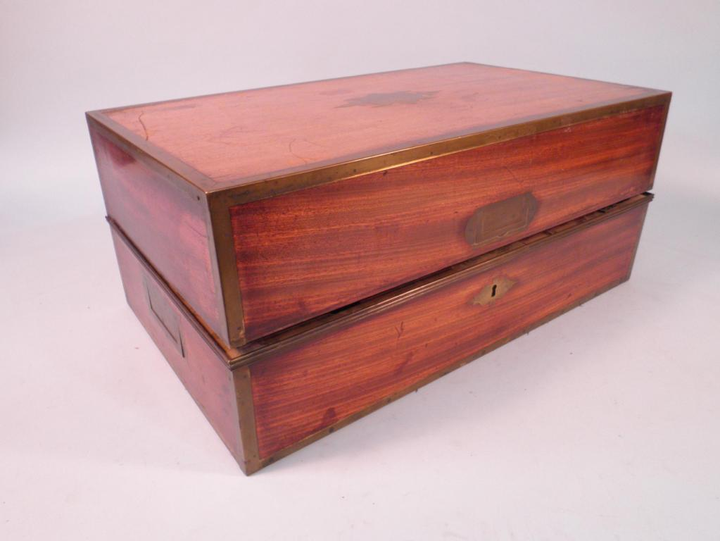 A mid 19thC mahogany and brass bound campaign writing box