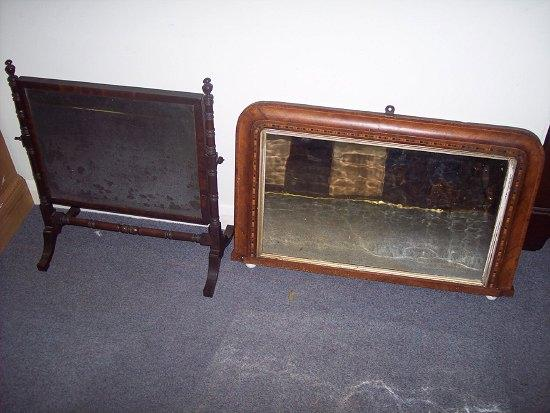 A Victorian walnut framed overmantel mirror the arch glass over