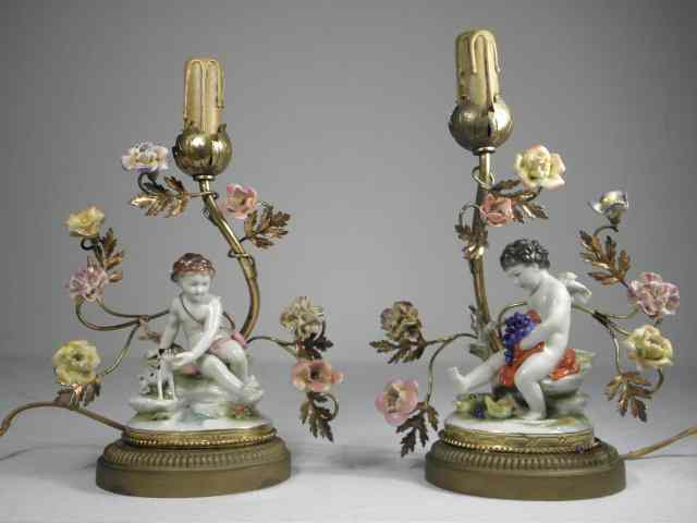 Pair of small continental gilt bronze and porcelain boudoir lamps