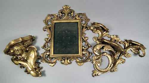 A Continental giltwood wall bracket of rococo design carved with