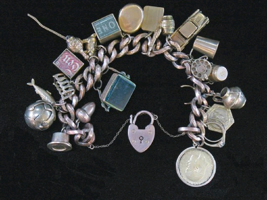 A LARGE 9CT ROSE GOLD CURB LINK BRACELET some links