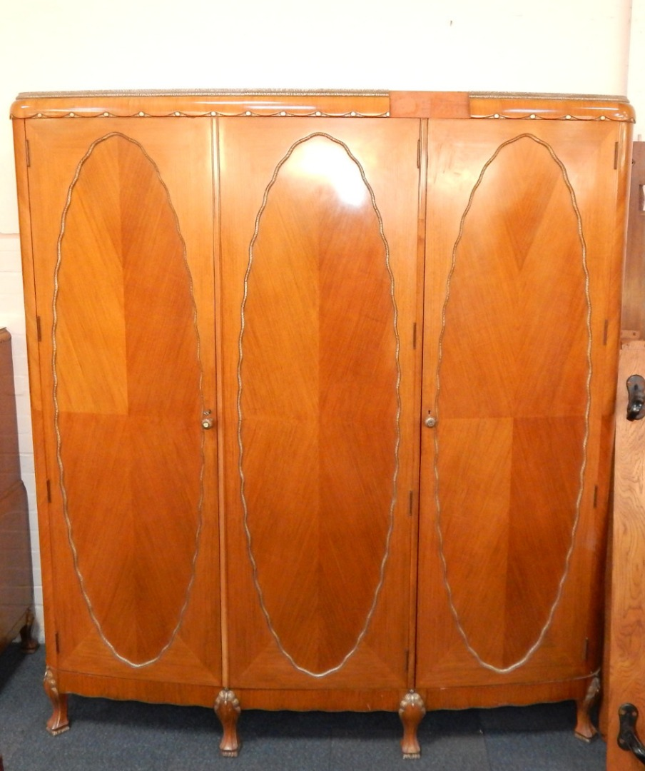 An Art Deco walnut mahogany and faux metal trimmed bedroom