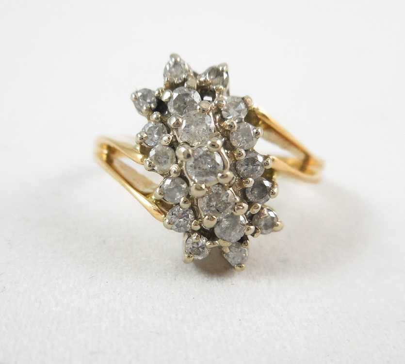 DIAMOND AND TEN KARAT GOLD CLUSTER RING set with 19