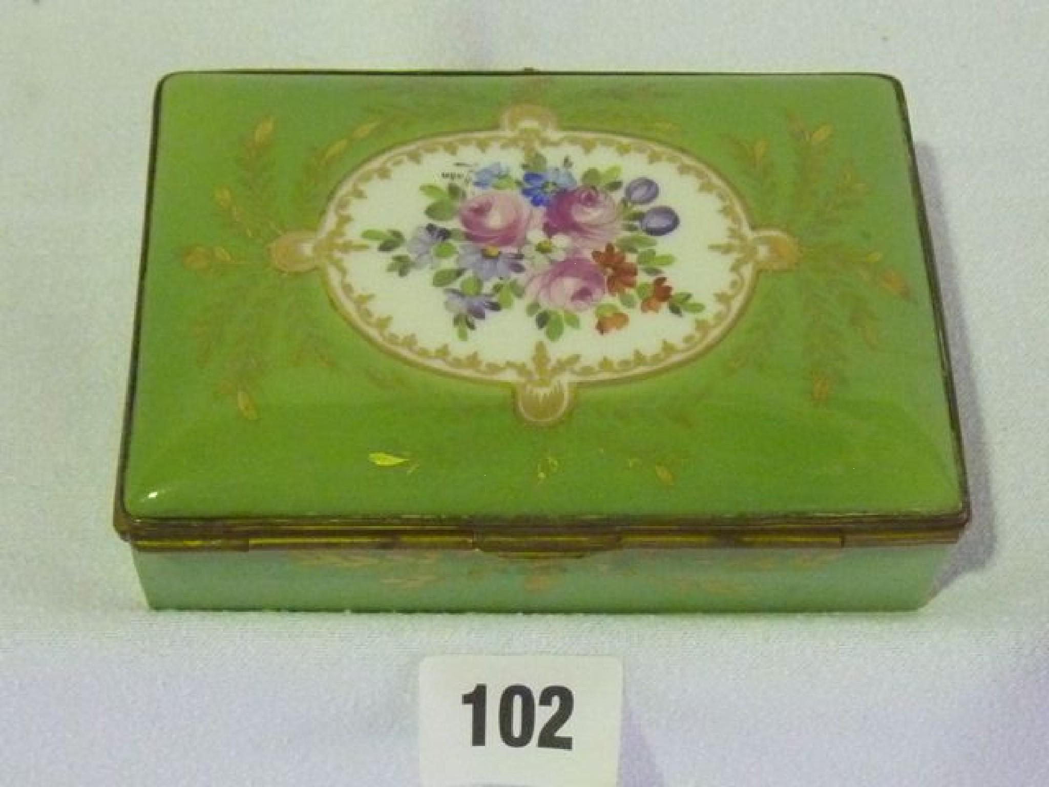 A porcelain dressing table box hand painted with a bouquet