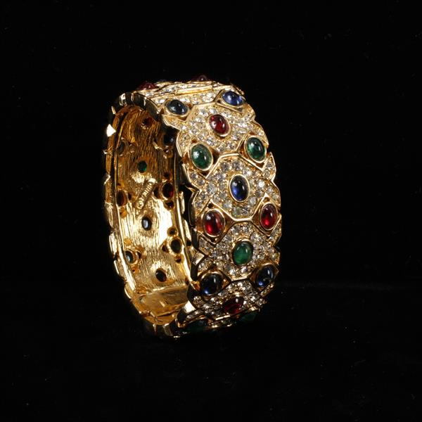 Ciner gold tone and pave hinged bangle bracelet with jewel