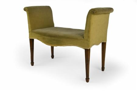 A George III mahogany framed window seat the outscrolling arms