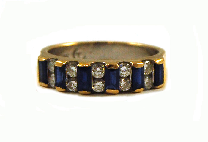 SAPPHIRE DIAMOND AND EIGHTEEN KARAT GOLD RING set with six
