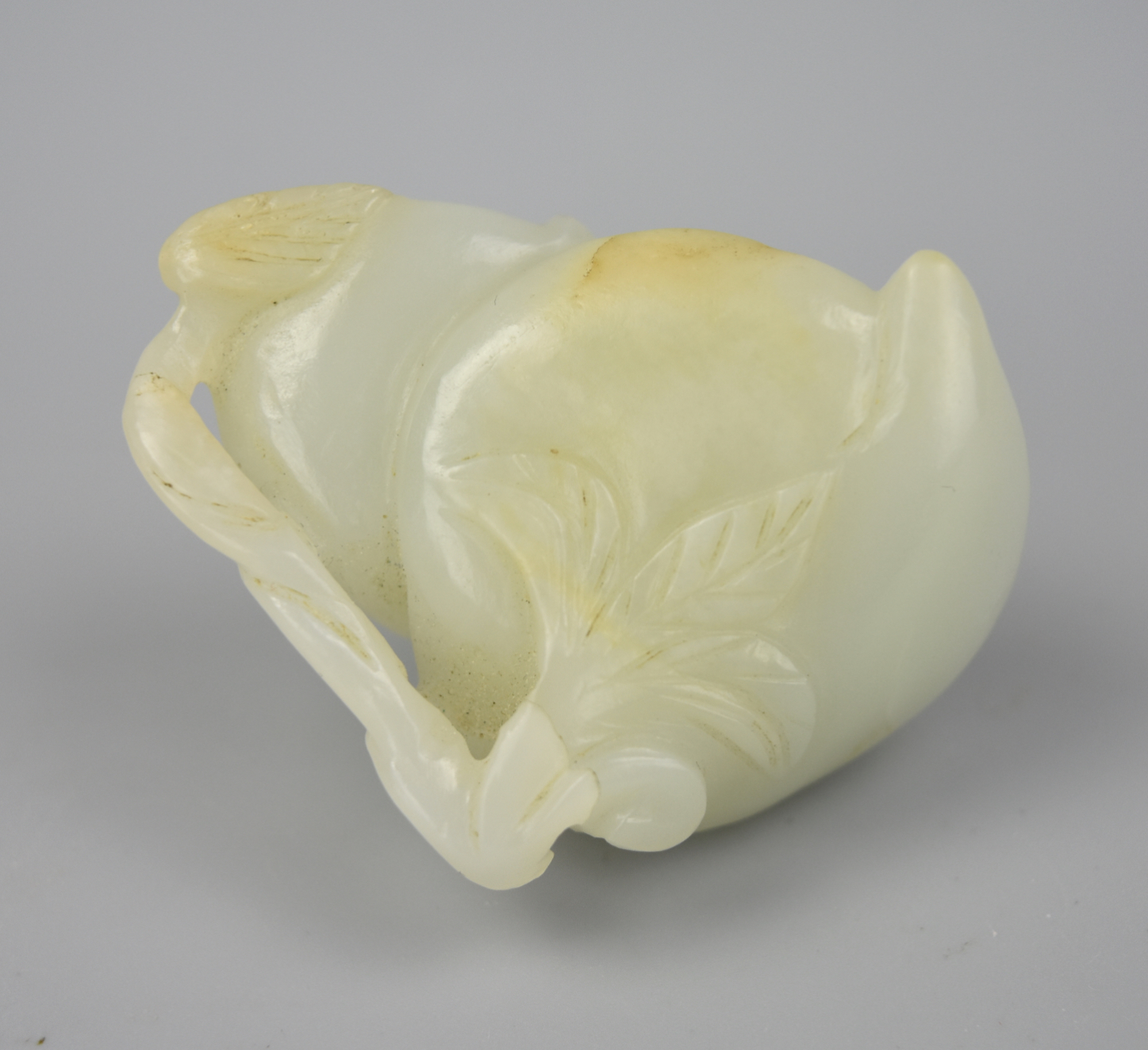 CHINESE WHITE JADE PEACH PENDANT QING DYNASTY A Qing dynasty
