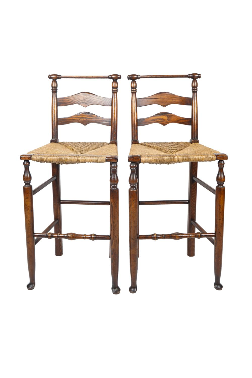 PAIR OF PROVINCIAL CARVED WOOD HIGH STOOLSwith woven rush seats