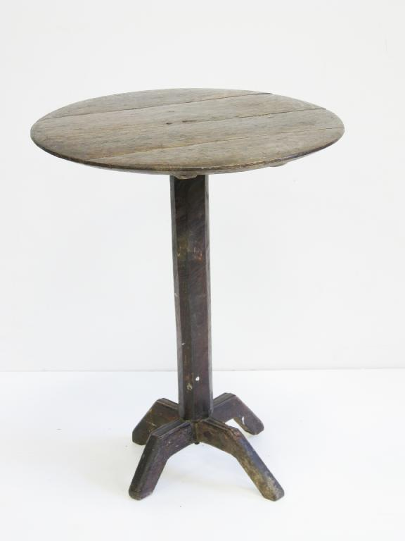 A primitive oak Pillar Table with circular top on chamfered