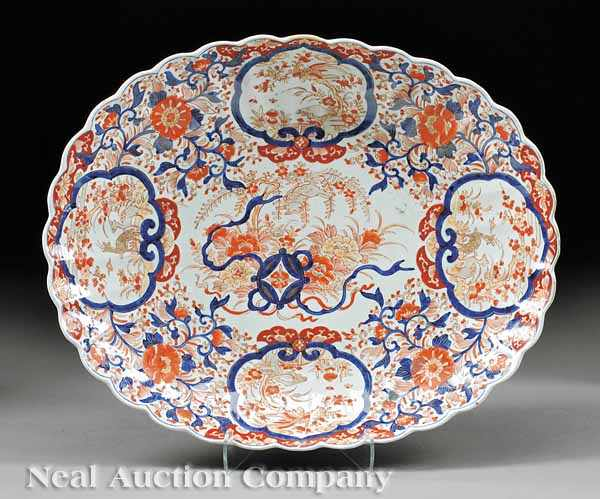 A Large Japanese Imari Chrysanthemum Form Porcelain Dish decorated in