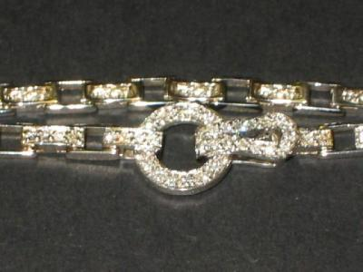A DIAMOND BRACELET comprising oblong 18ct white gold links set