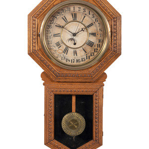 An Oak School Wall Clock Late 19th Century with partially