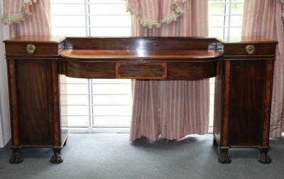 A Regency mahogany pedestal sideboard crossbanded in burr walnut the
