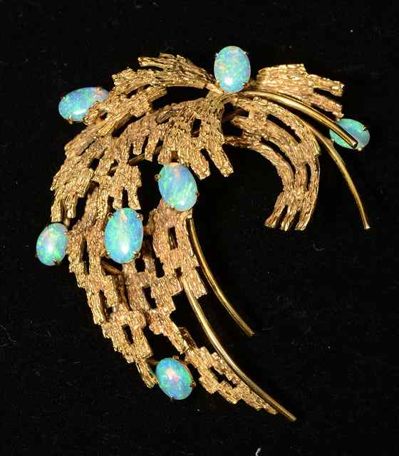 AN OPAL SET SPRAY BROOCH in the form of abstract