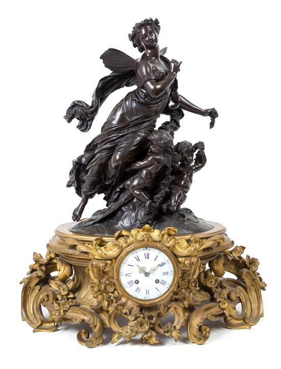 Sale 493 Lot 167 A French Gilt and Patinated Bronze